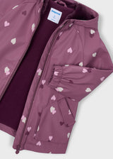 Close-up of mauve raincoat zipper soft lining elastic cuff and pocket