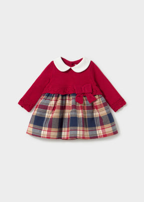 Front view of red Mayoral newborn girl knit dress with ivory collar and plaid skirt