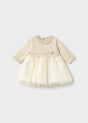 Front view of ivory Mayoral newborn girl dress with scalloped collar and gold-dot tulle skirt