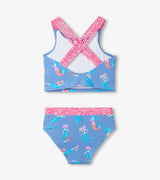 Back view of girls mermaid tankini swimsuit showing triple crisscross straps and coordinated patterned trim.