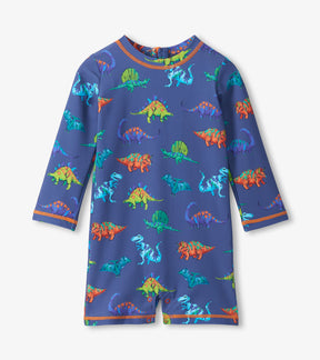 Hatley navy baby rashguard swimsuit with colourful dinosaurs and orange trim, front view