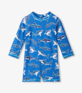 Hatley blue baby rashguard swimsuit with patterned sharks and aqua trim, front view